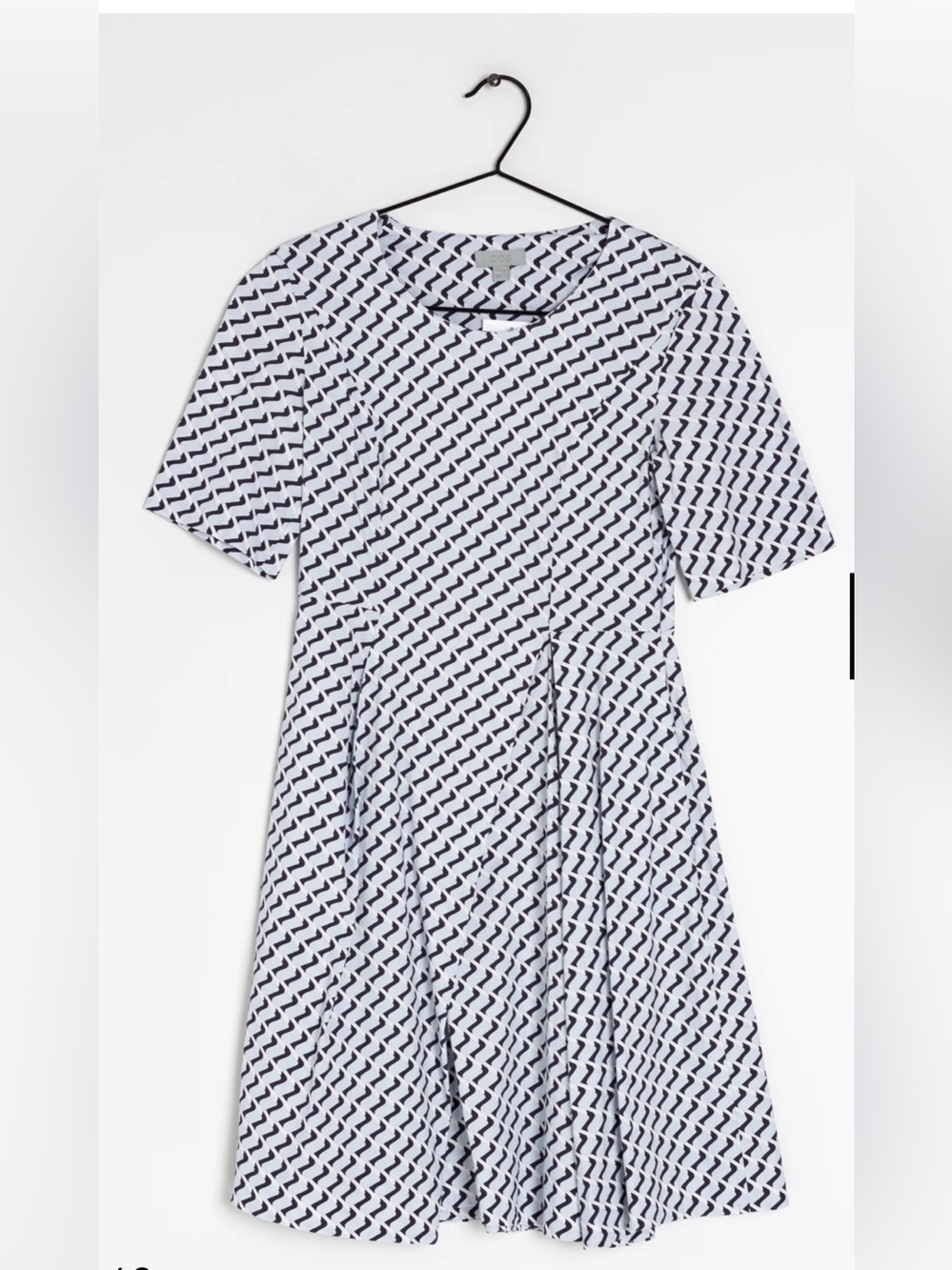 COS dress features a distinct geometric chevron pattern in blue and white.